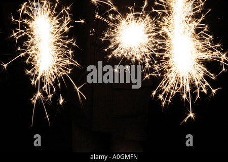 three fireworks going off in the night sky Stock Photo