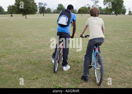 Boys riding bikes in the park