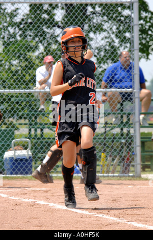 Teenage female Major league Softball action Stock Photo