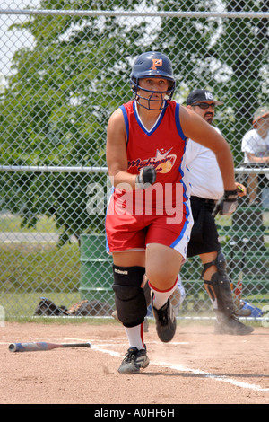 Teenage female Major league Softball action Stock Photo