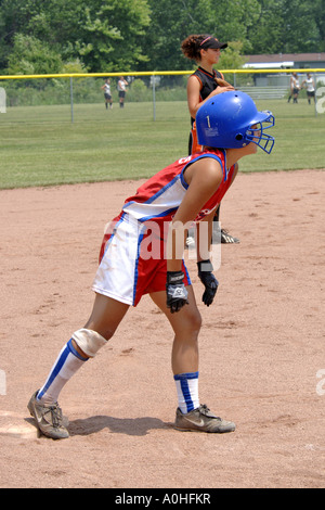 Teenage female Major league Softball action Stock Photo