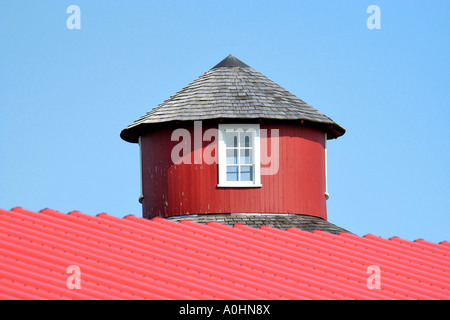Round red cupola on top of a barn Stock Photo