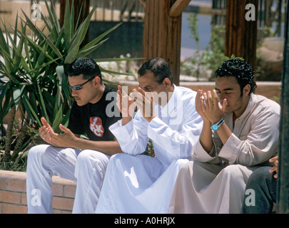 3 Islamic men praying Stock Photo