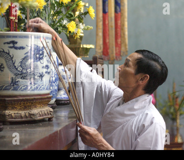 A Buddhist monk in a temple in Vietnam Stock Photo