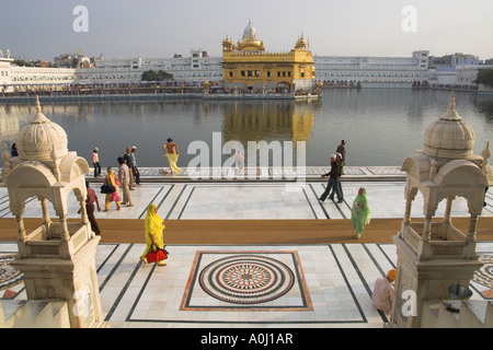 India Punjab Amritsar Golden Temple Prominent Sikh spiritual shrine large view from entrance gate with pilgrims temple and pool Stock Photo