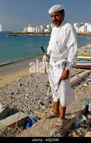 Man with dschambija, harbor of Al Mukalla, Mukalla, Yemen Stock Photo