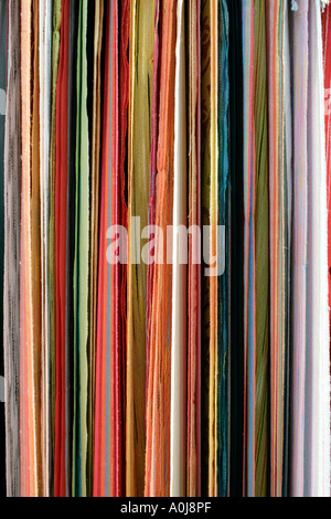 Hanging coloured pleated fabric Stock Photo