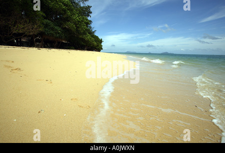 A quiet beach on the island of Bu Bu in Southern Thailand This is one of the smallest islands and has no inhabitants just holiday bungalows Stock Photo