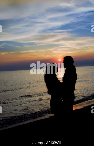 Romantic couple at sunset Stock Photo