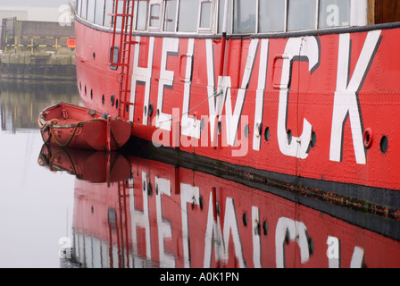 The Helwick LV14 Lightship at Cardiff Bay, Cardiff, UK. The name is reflected in the water. Stock Photo