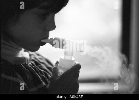 Detroit Michigan Mariel West uses a nebulizer for her asthma Stock Photo