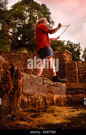 A WATER DIVINER AT CHEDWORTH ROMAN VILLA NEAR CIRENCESTER GLOUCESTERSHIRE WHERE THE 4TH CENTURY WATER SHRINE IS DRYING UP Stock Photo