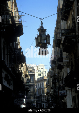 Ramadan lamp hanging between houses in a street in Alexandria Egypt Stock Photo