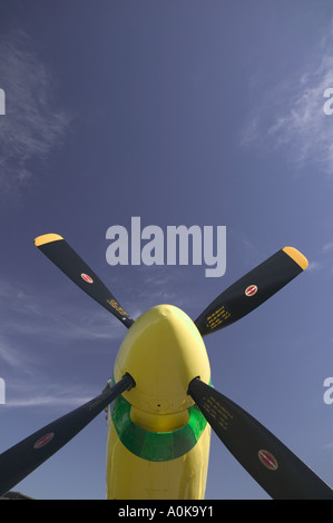 Yellow P-51 Mustang aircraft, looking up at the propeller from below Stock Photo