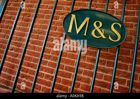 an Marks and spencer sign on railings at a store in Exeter, Devon. Stock Photo