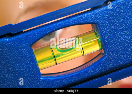 bubble level in hand Stock Photo