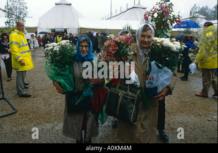 Visitors leave Chelsea Flower Show in the rain, in May, in Chelsea, London Stock Photo