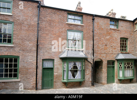 Exterior of a row of back to back houses on the corner of Inge Street and Hurst Street Birmingham England Stock Photo