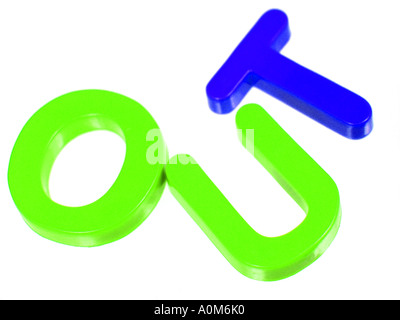 OUT spelled by brightly coloured fridge magnets Stock Photo
