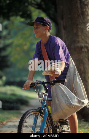 newspaper delivery boy  USA PA Pennsylvania newsboy carrier deliver delivery Stock Photo