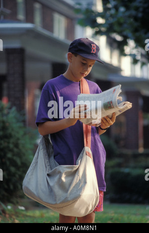 newspaper delivery boy  USA PA Pennsylvania walking newsboy carrier deliver delivery Stock Photo