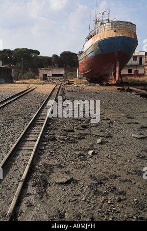 Abandoned fishing ship in a Seixal shipyard. Portugal Stock Photo