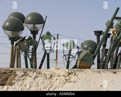 Broken street lamps in council yard Stock Photo