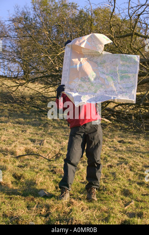 walkers map is blown away in strong winds Stock Photo