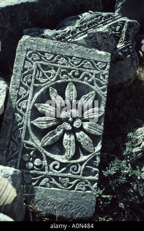 Carved flower ornament in stone tablet at Roman amphitheatre ruin Xanthos Turkey Stock Photo