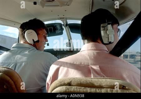 Pilot and Navigator contact control tower Cessna Stock Photo