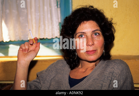 Sao Paulo, Brazil. Middle-aged woman with a cigarette in her hand looking defiantly into the camera. Stock Photo