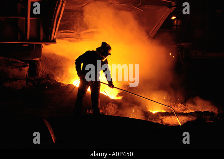 Team member taking iron samples using a lance on Blast Furnace No 5 at Corus Port Talbot Steelworks South Wales UK Stock Photo