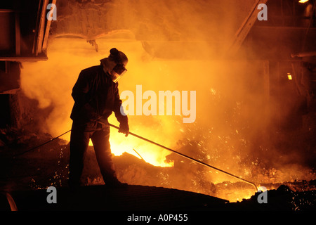 Team member taking iron samples using a lance on Blast Furnace No 5 at Corus Steelworks Port Talbot South Wales UK EU Stock Photo