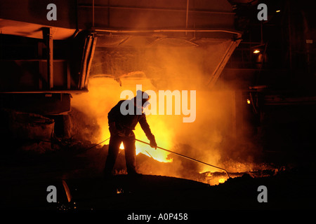 Team member taking iron samples using a lance on Blast Furnace No 5 at Tata Corus Steelworks Port Talbot South Wales UK EU Stock Photo