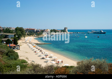 View over Beach and Town with the Byzantine Watchtower in the distance, Ouranopolis,  Athos Peninsula, Halkidiki, Greece Stock Photo
