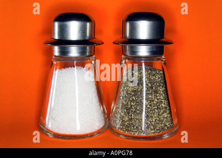 Salt Pepper orange background Stock Photo