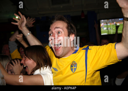 Swedish fan watching last minute winner during 1-0 win over Paraguay, 2006 World Cup Finals, Famous Three Kings pub, London Stock Photo
