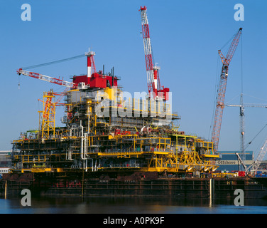 oil rig in a floating barge and oil tanker ship in the off shore of the ...