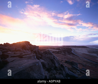 Sun rising over Stanage Edge and view towards Higger Tor in England's Peak District National Park Stock Photo