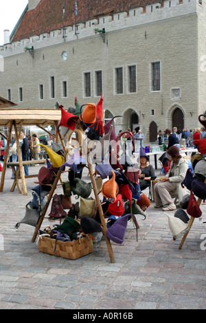 Market stall in the square of the old town in Tallinn Estonia with the town hall in the background Stock Photo