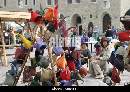 Market stall in the square of the old town in Tallinn Estonia with the town hall in the background Stock Photo