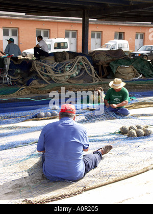 Old Fishermen Mending Their Nets Puerto Deportivo de Fuengirola Fuengirola Port Costa del Sol Spain Stock Photo