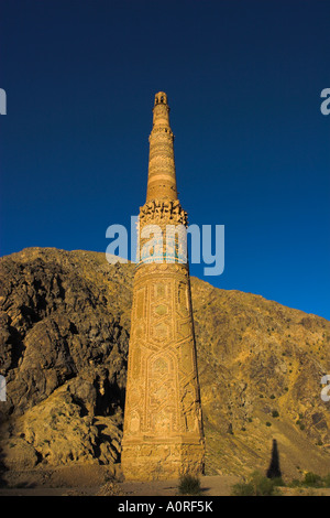 Minaret of Jam UNESCO World Heritage Site dating from the 12th century with Quasr Zarafshan in background Ghor Province Stock Photo