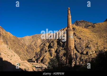 Minaret of Jam UNESCO World Heritage Site dating from the 12th century with Quasr Zarafshan in background Ghor Province Stock Photo