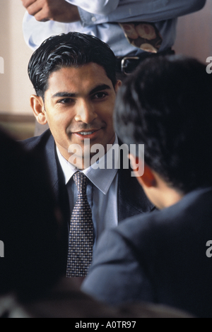 Close up of two Latino businessman in the middle of a discussion Stock Photo
