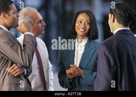 Agreement between a team of Hispanic, African-American and Caucasian executives planning a successful business deal Stock Photo