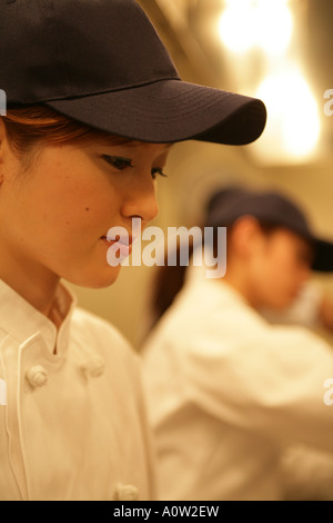 Close up of a female chef in the kitchen Stock Photo