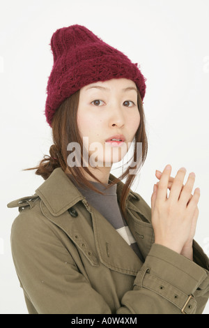 Attractive young woman wearing a knit hat Stock Photo - Alamy