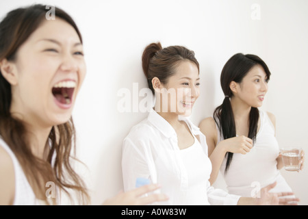 Close up of three young women smiling Stock Photo