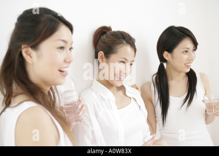 Close up of three young women smiling Stock Photo